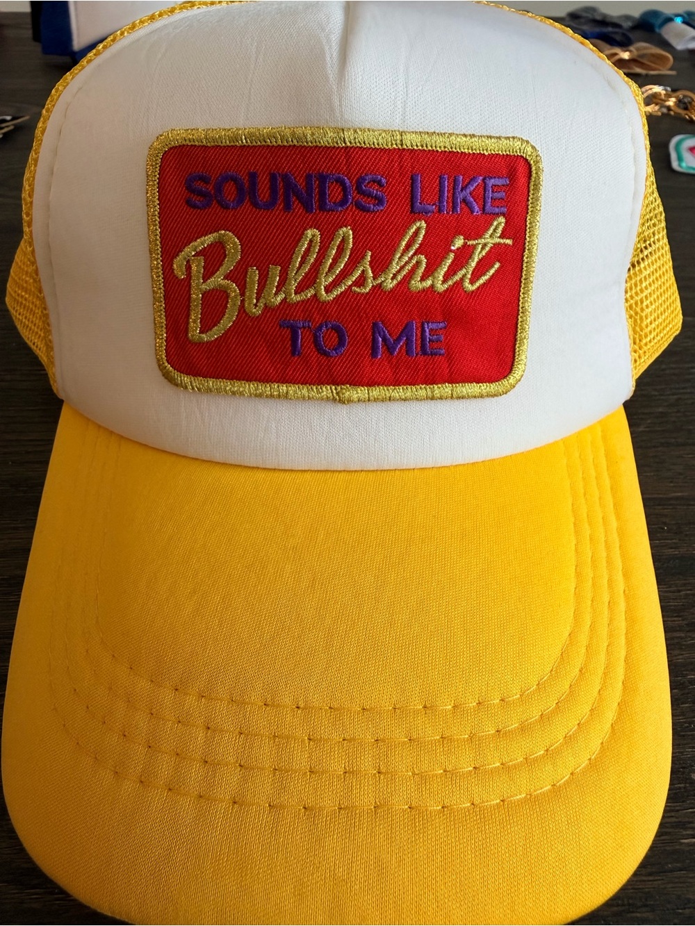 Yellow and White Trucker Hat with Red Patch - Bold Text